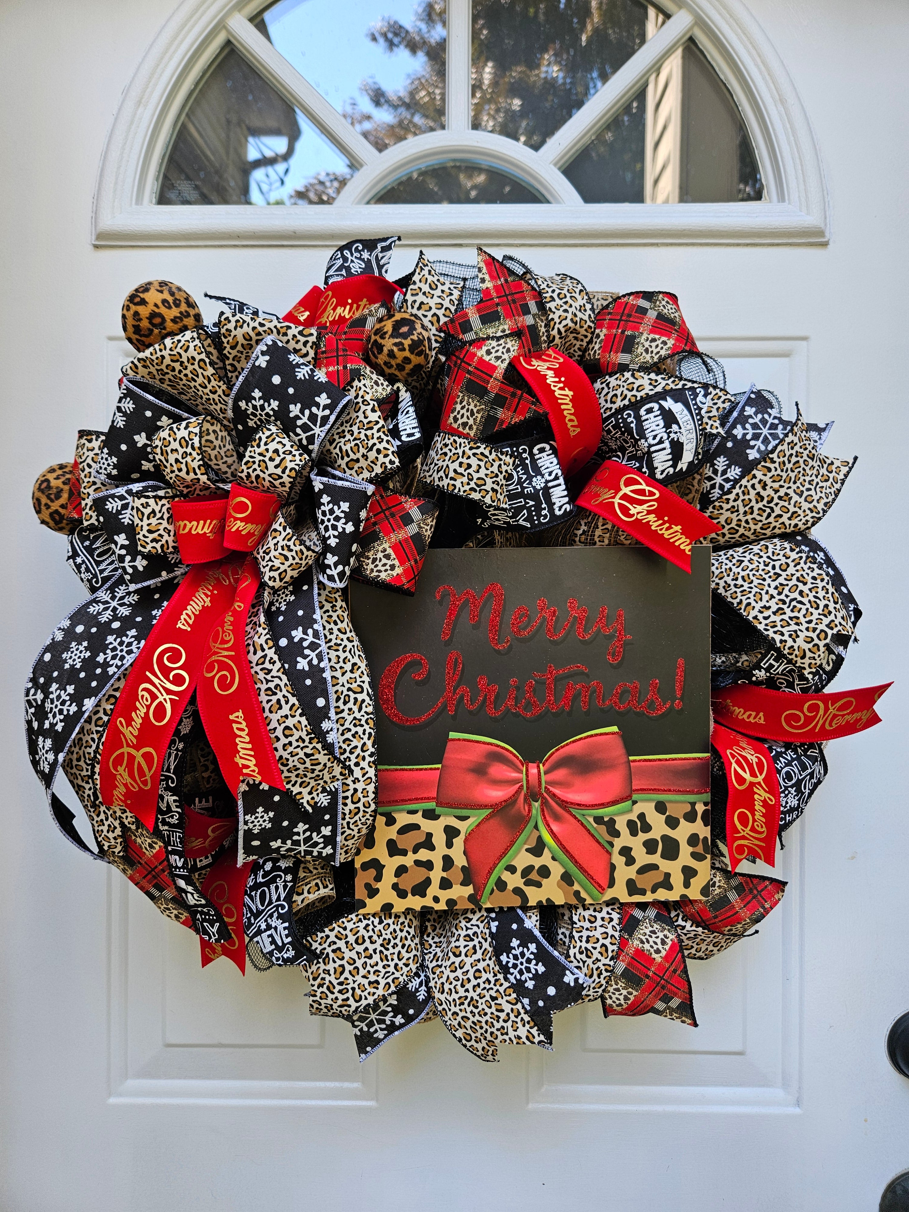 Red, Black, Gold and White Cheetah WELCOME sign, Red and black mesh with Cheetah Ribbons, outlets Welcome with Cheetah sign and ribbons